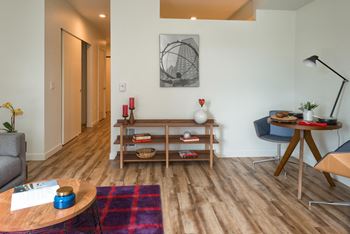 A living room with a couch and a table
